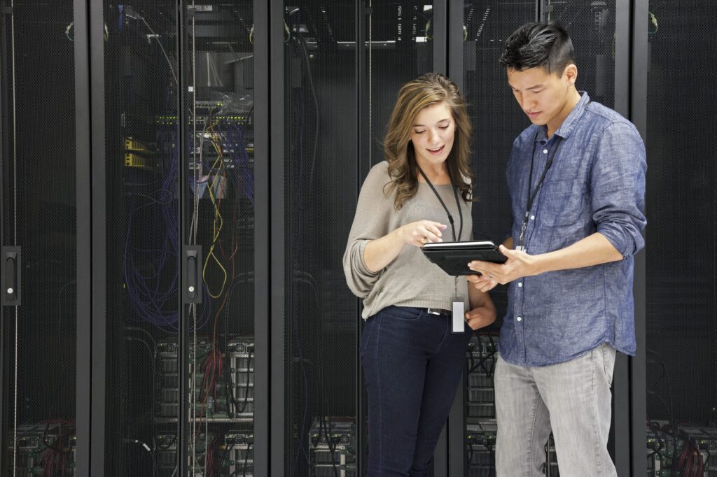 Engineers in a server room — Infineon